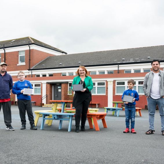 Headteacher and kids from Bankhead Primary were given tablets by Wheatley thanks to funding from Barclays