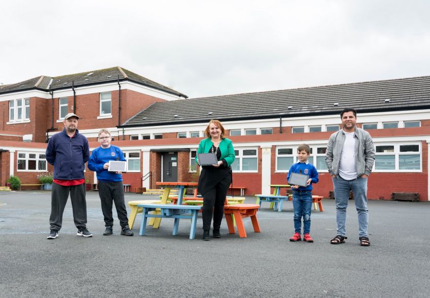 Headteacher and kids from Bankhead Primary were given tablets by Wheatley thanks to funding from Barclays