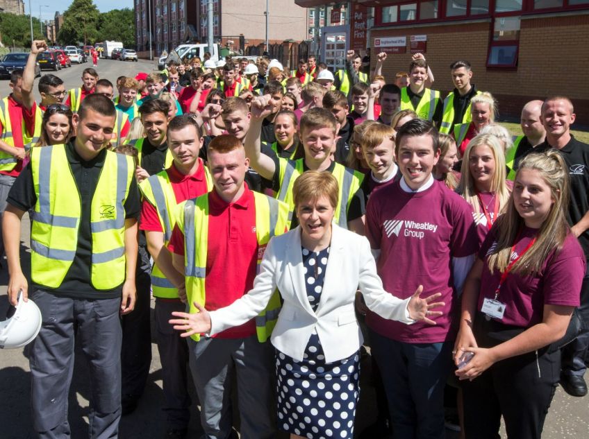 First Minister is joined by apprentices at EIB funding deal