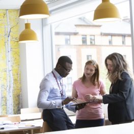 Wheatley staff in conversation at a desk