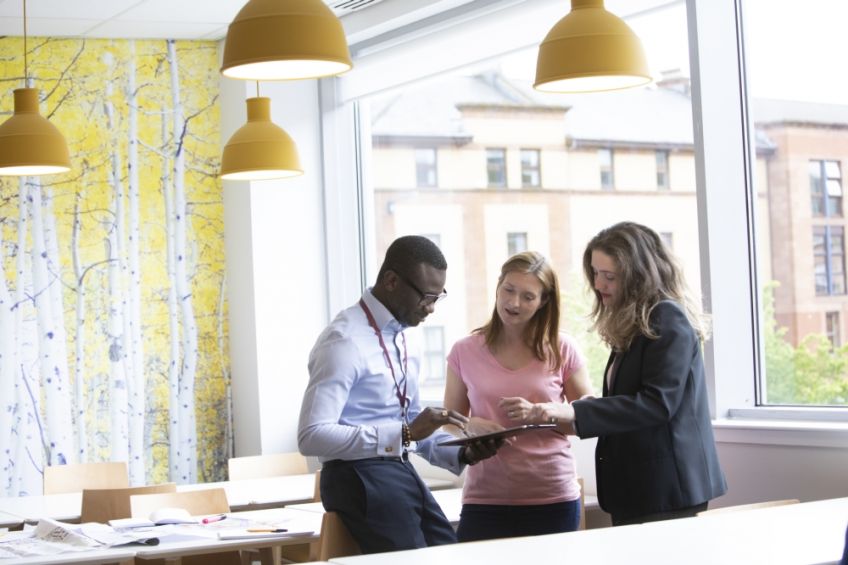 Wheatley staff in conversation at a desk