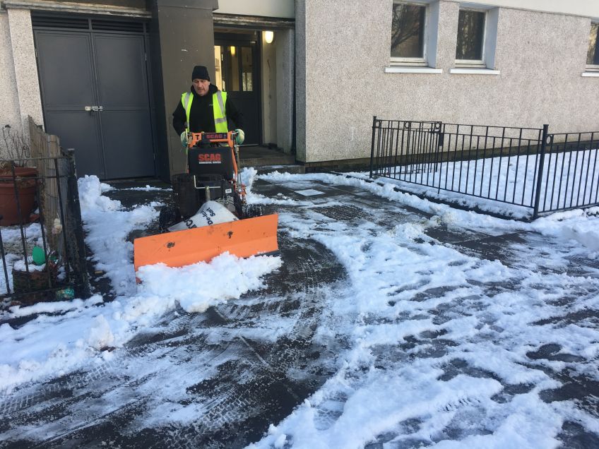 Wheatley staff out gritting pathways and pavements