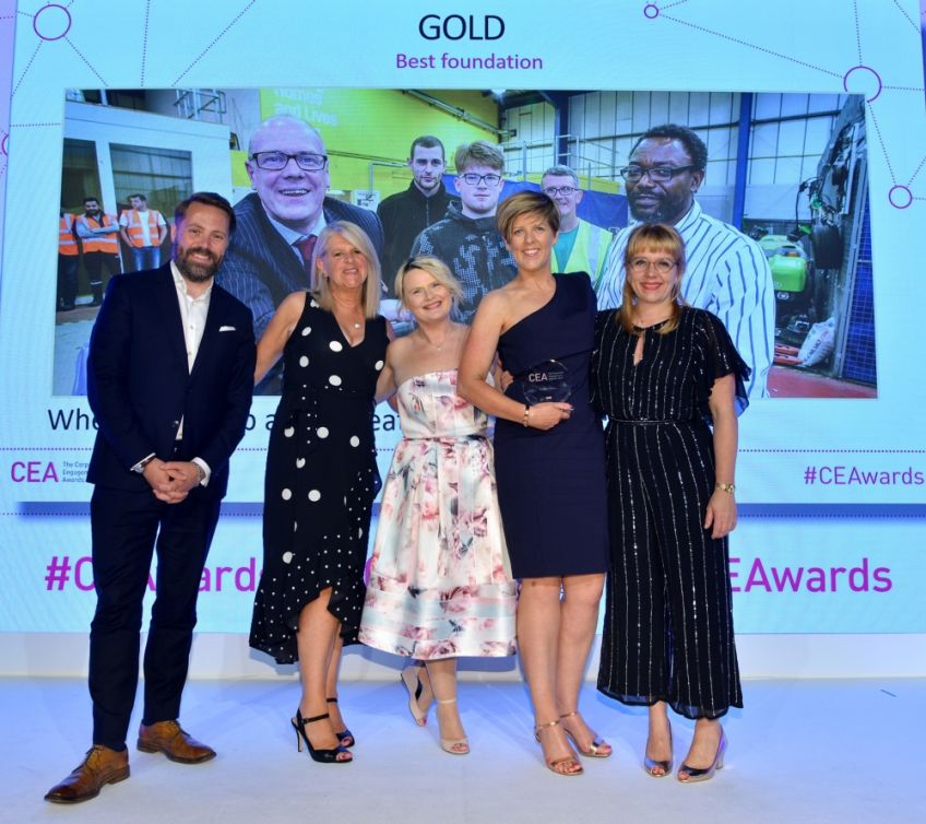 Wheatley Foundation staff on stage receiving their award