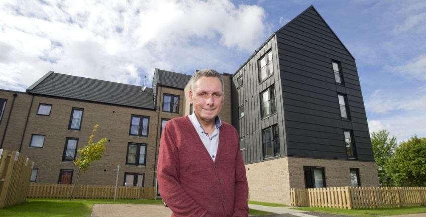 GHA tenant outside of new homes in Sighthill, Glasgow.
