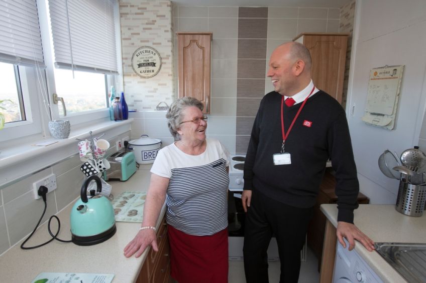 GHA housing officer and tenant in kitchen
